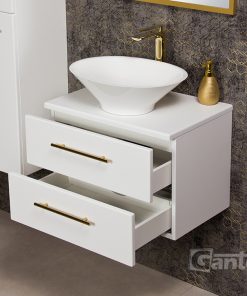 White vanity unit with gold tap